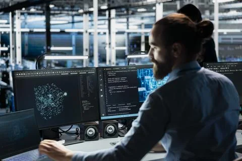 Data center programmer adjusting AI model parameters to upgrade systems Stock Photos