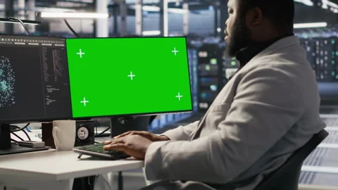 Data center programmer coding on green screen PC, monitoring AI systems Stock Footage 309621610