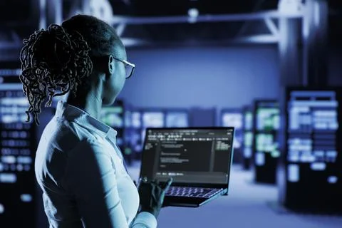Data center programmer runs code Stock Photos
