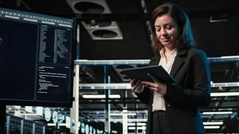 Data center programmer with tablet scanning rigs to create digital twin Stock Footage 329323956