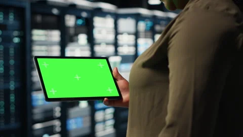Data center programmer uses green screen tablet to minimizing downtime Stock Footage 317204832