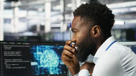 Data center programmer uses neural networks node tree program to identify issues Stock Footage 309507428