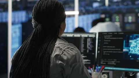 Data center programmer using artificial intelligence deep learning models Stock Photos