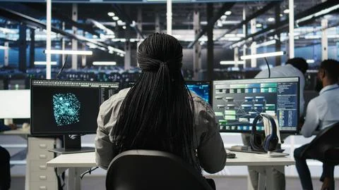 Data center programmer using artificial intelligence deep learning models Stock Photos