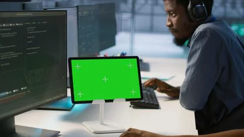 Data center programmer using mockup tablet, maintaining company network Stock Photos