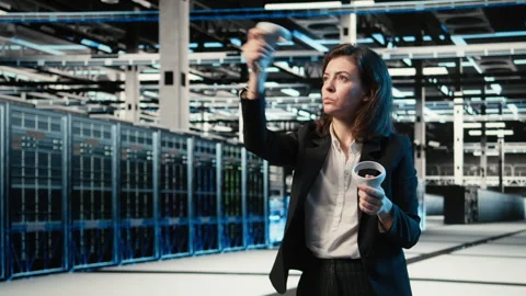 Data center programmer using VR equipment to create digital twin scan of rigs Stock Footage 329334039