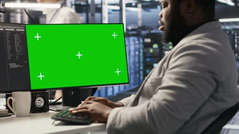 Data center programmer working on green screen desktop PC Stock Footage 309615645