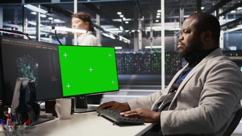 Data center programmer working on green screen desktop PC Stock Footage 309792223