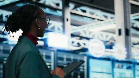 Data center programmer writing code for resource optimization using tablet Video stock 329652290