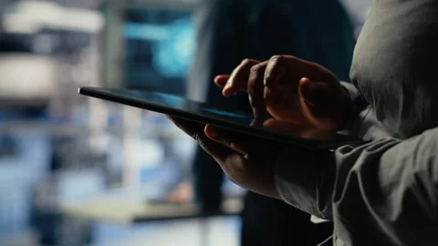 Data center programmers check AI dashboard using tablet, doing systems review Stock Footage 314686299