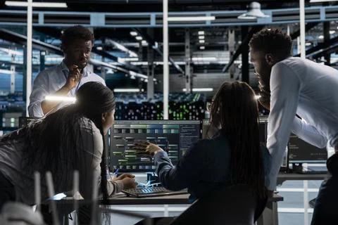 Data center programmers doing brainstorming, setting up machine learning systems Stock Photos