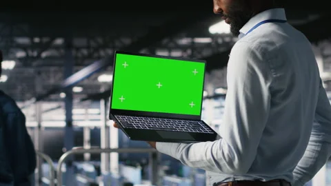 Data center programmers on industrial platform using green screen laptop Stock Footage 310276781