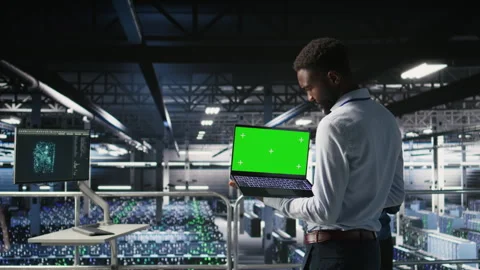 Data center programmers on industrial platform using green screen laptop Stock Footage 310279239