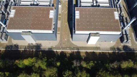 Data Center Revealed Behind Forest – Top Down Aerial Flight Video stock 346916120