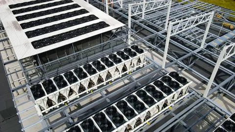 Data center rooftop featuring new cooling systems and industrial fans Stock Photos