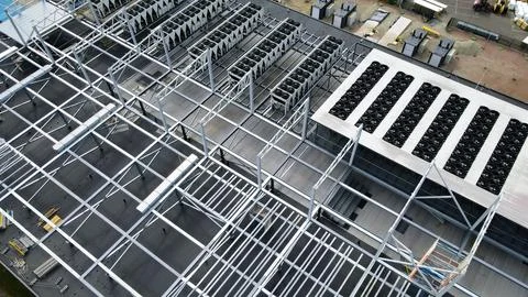 Data center rooftop infrastructure with cooling systems under construction Stock Photos