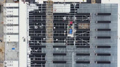 Data center rooftop in Lancaster reveals dense cooling unit grid, steel Stock Footage 337529512