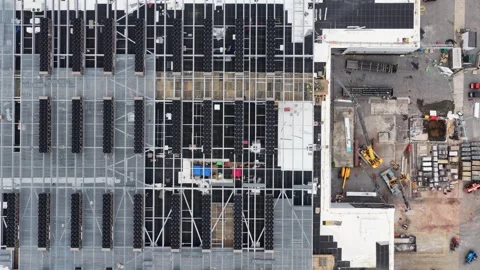Data center rooftop in Lancaster reveals symmetrical rows of black cooling Video stock 337978503