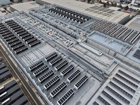 Data center rooftop showing cooling units and solar panels Stock Photos
