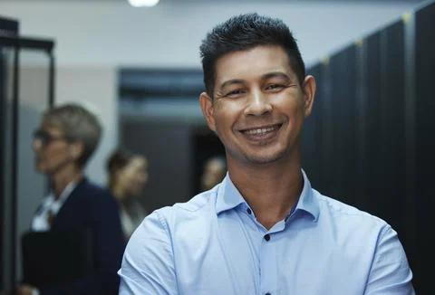 Data center, server room and portrait of man with team for programming, coding Foto stock