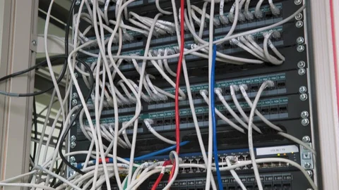 Data Center Servers Switchboard panel with chaotic mess cables  tilt down Vídeo Stock 102149641