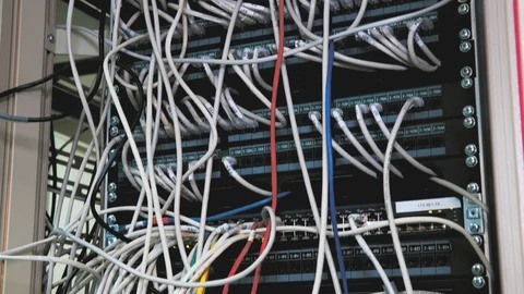 Data Center Servers Switchboard panel with chaotic mess cables - tilt down Stock-Footage 102149664