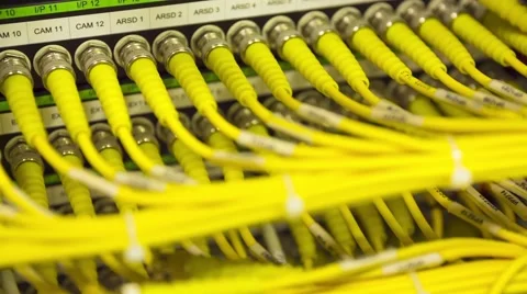 Data Center Servers With Yellow Cable Upload And Download Server  - Pan Left Видео 58939773