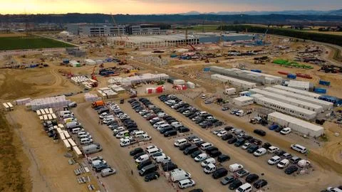 Data center site at sunrise with the workforce car park Stock Photos