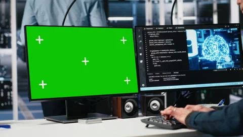 Data center software developer managing AI systems using green screen PC Stock Footage 313566277