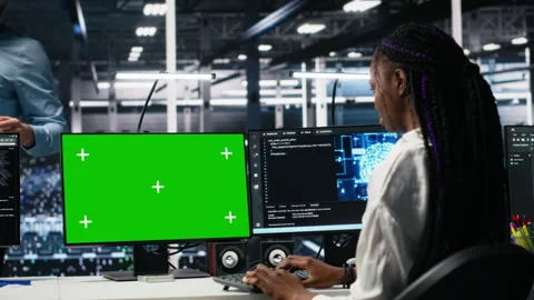 Data center software developer managing AI systems using green screen PC Stock Footage 313566603