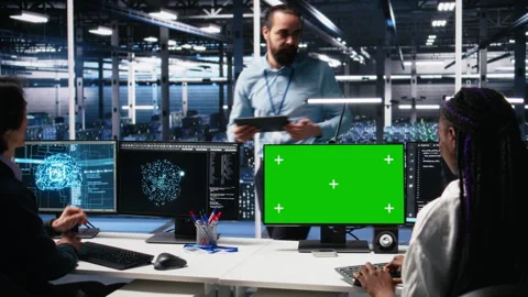 Data center software developer managing AI systems using green screen PC Stock Footage 313638524