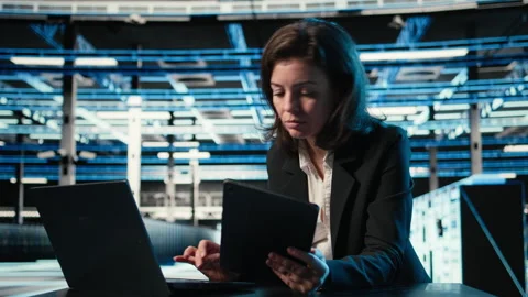 Data center software developer optimizing equipment rigs using devices Stock Footage 329327471