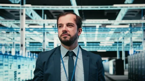 Data center software developer removing VR goggles after finishing task Stock Footage 329530152