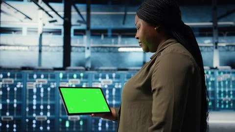 Data center software developer uses green screen tablet to minimize downtime Stock Photos