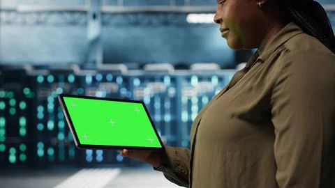 Data center software developer uses green screen tablet to minimize downtime Stock Photos