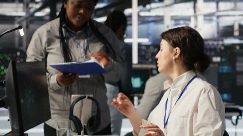 Data center software developer using PC to monitor neural networks Stock Footage 309624198