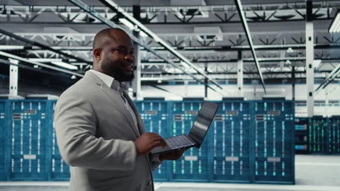 Data center software developer using tablet to do AI algorithms improvements Stock Footage 311959754