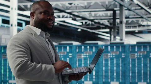 Data center software developer using tablet to do AI algorithms improvements Stock-Footage 311959795