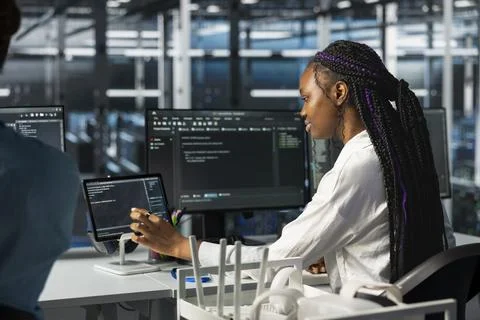 Data center software developer using tablet, deploying servers Stock Photos