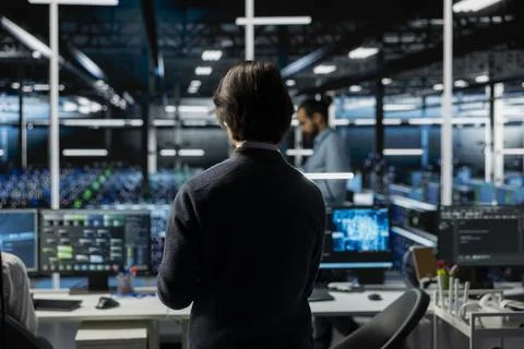 Data center software developer working on databases supporting AI Stock Photos