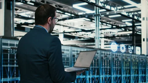 Data center software developer writing code optimization using laptop Video stock 329720816