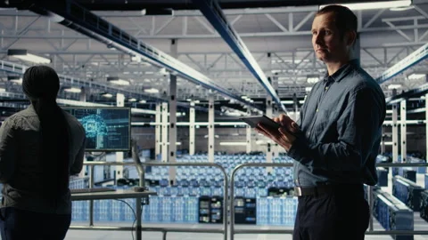 Data center software developers investigate neural networks configuration Stock Footage 314804746