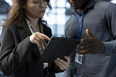 Data center software developers using laptop, conducting security audits Stock Photos