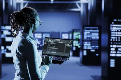 Data center specialist runs code Stock Photos