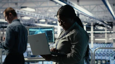 Data center supervisor on industrial platform working to improve AI rigs Stock Footage 314686408