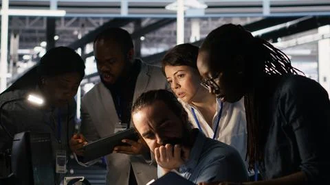Data center system administration team collaborating on AI automation Stock Photos