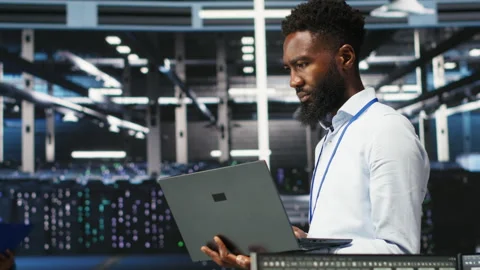 Data center system administrator analyzing gear issues using node tree tools Stock Footage 307019324