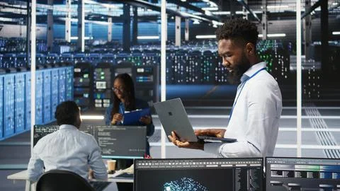 Data center system administrator analyzing gear issues using node tree tools Stock Photos