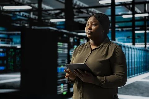 Data center system administrator conducting tests on equipment Stock Photos