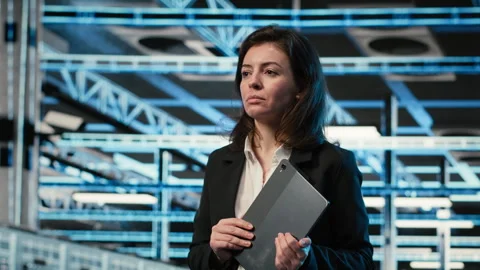 Data center system administrator looks at virtual graphics to optimize servers Stock Footage 329326807